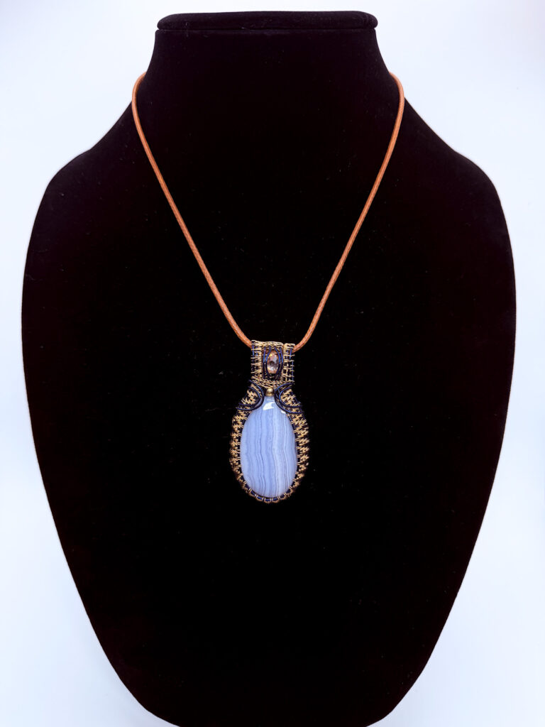 Team Spirit Wire Wrapped Blue Lace Agate Necklace 6 Photo of Team Spirit Wire Wrapped Blue Lace Agate Necklace on a neck form