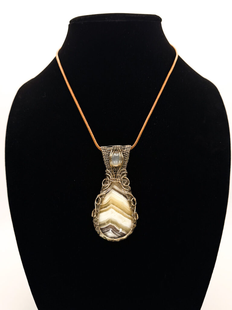 Bold Harmony Wire Wrapped Zebra Jasper Necklace 6 Photo of Bold Harmony Wire Wrapped Zebra Chalcedony Necklace on a necklace form