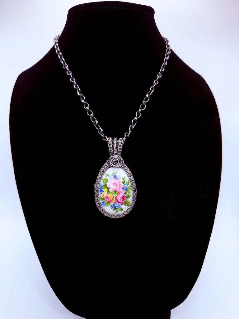 Photo of Vibrant Energy Wire Wrapped Agate and Moonstone Necklace on a neck form