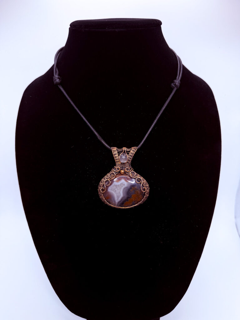 Photo of Vibrant Energy Wire Wrapped Agate and Moonstone Necklace on a neck form