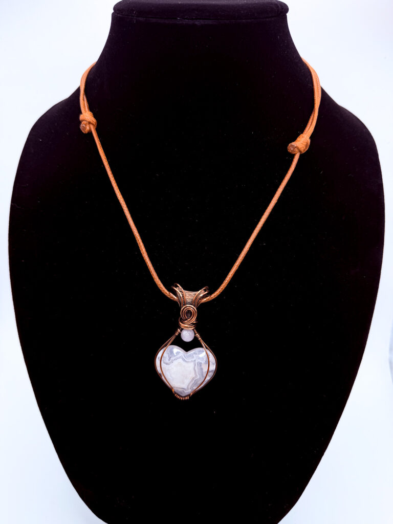 Pure Balance Wire Wrapped White Plume Agate Heart Necklace 6 Photo of Pure Balance Wire Wrapped White Plume Agate Heart Necklace on a neck form