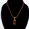 Photo of Radiant Energy Wire Wrapped Orbicular Agate Necklace on a neck form