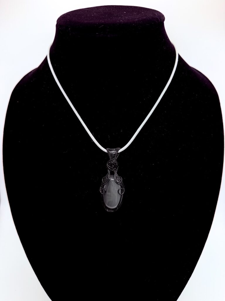 Photo of Mystic Strength Wire Wrapped Agate Necklace On an neck form