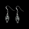 Elegant black hematite bead earrings. The design has a rice shaped bead with a 4mm round hematite bead on either end of the focal bead. These earrings have .925 Sterling Silver French ear wires.