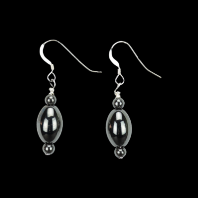 Elegant black hematite bead earrings. The design has a rice shaped bead with a 4mm round hematite bead on either end of the focal bead. These earrings have .925 Sterling Silver French ear wires.