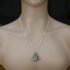 Aventurine pendant shown on a silver chain on a mannequin