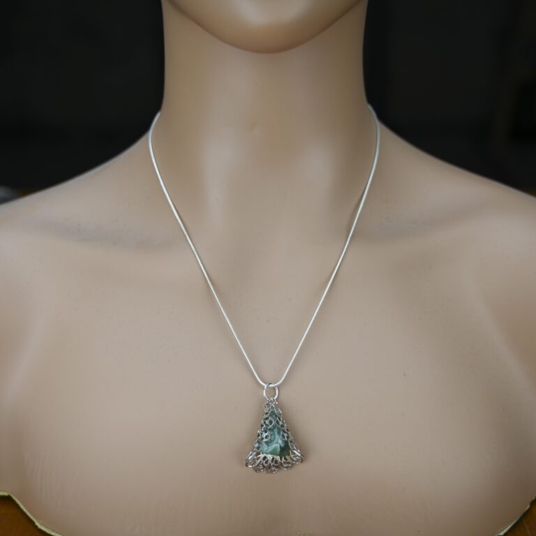 Aventurine Pendant - Reiki Infused 2 Aventurine pendant shown on a silver chain on a mannequin