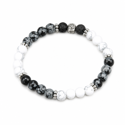 Black and white bracelet made from snowflake obsidian and howlite beads. Snowflake obsidian is black with gray running throughout the stone. Some beads are mostly black and others are mostly gray.