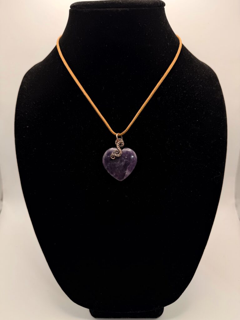 Image of Serene Heart Wire Wrapped Lepidolite Necklace. on a Neck Form