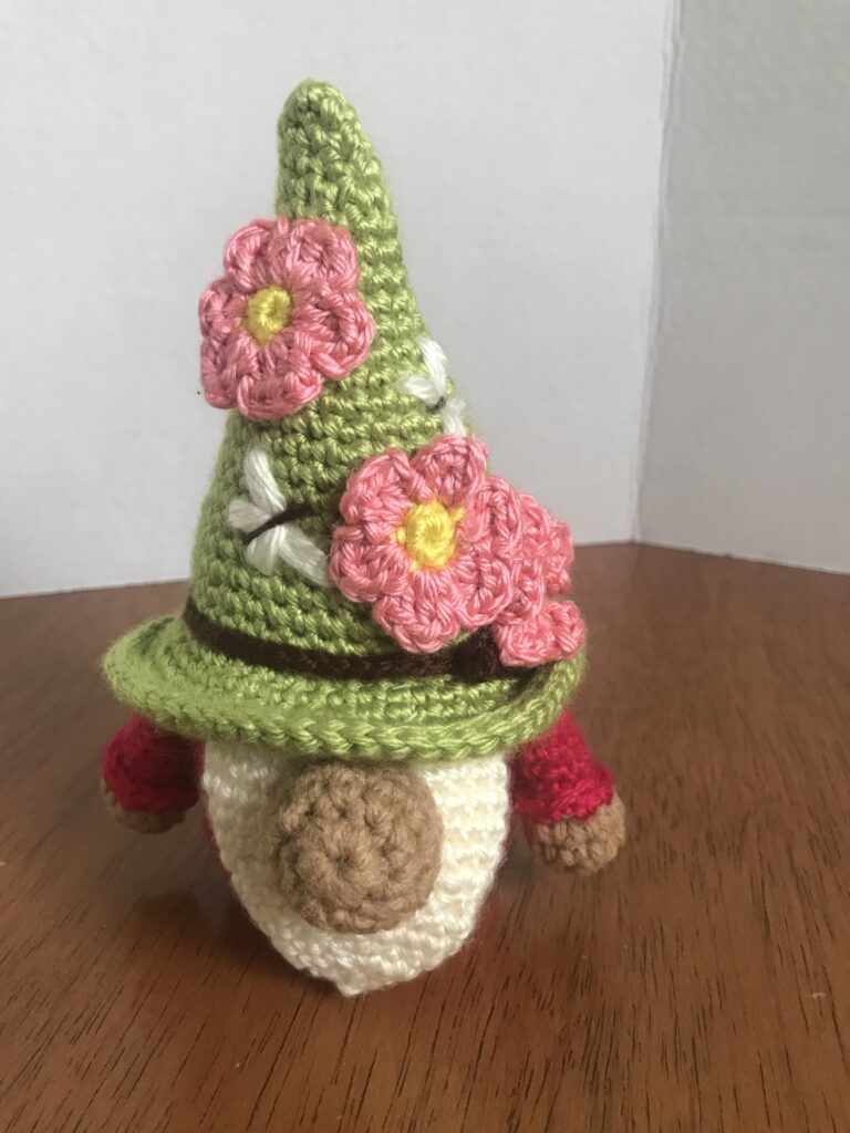 Handmade adorable rose-colored amigurumi gnome with pink flowers a whimsical gift 2 IMG 6072