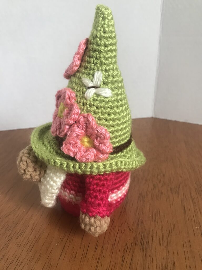 Handmade adorable rose-colored amigurumi gnome with pink flowers a whimsical gift 3 IMG 6073
