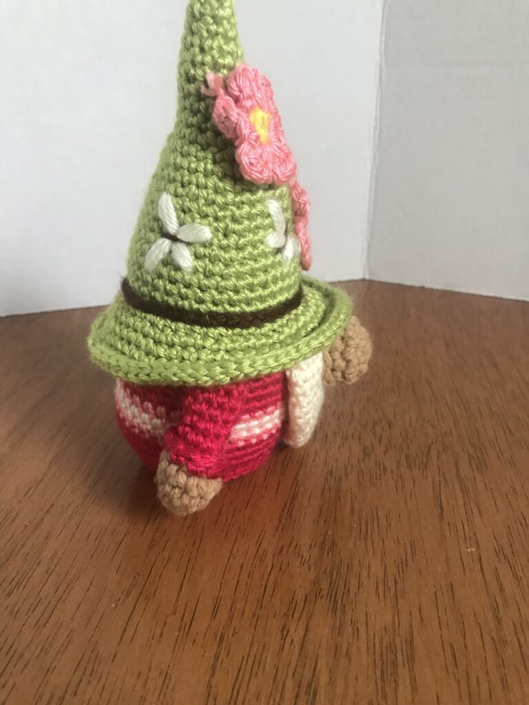 Handmade adorable rose-colored amigurumi gnome with pink flowers a whimsical gift 5 IMG 6075